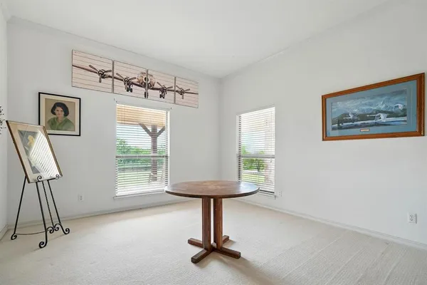 a room with gym equipment and a window