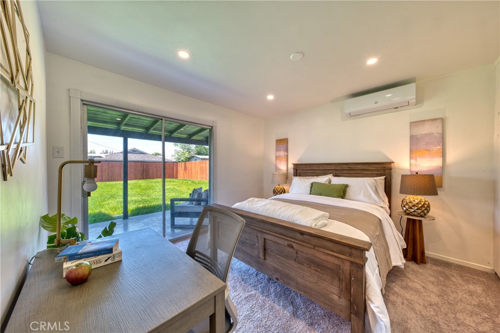2531 Calmia Road Duarte, CA 91010 - Photo 18 of 30 a bedroom with a bed a table and chairs