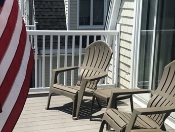 50 Humphrey Street, Unit 1 Swampscott, MA 01907 - Photo 1 of 12 a view of a balcony with chairs