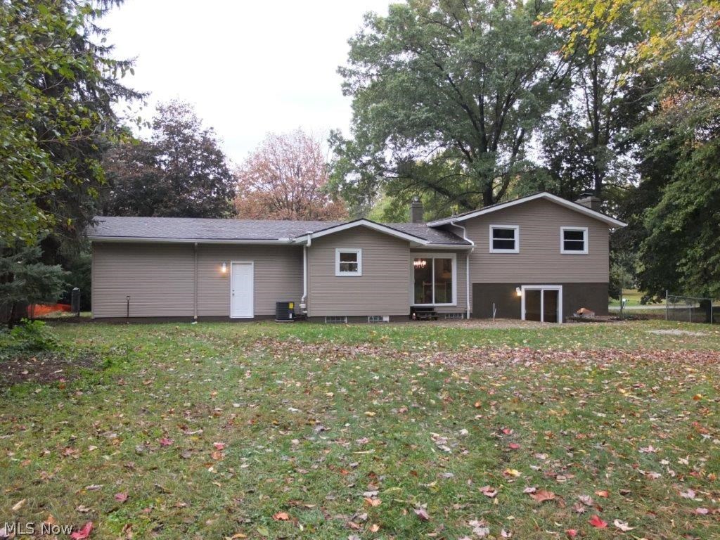 4262 Springdale Road Uniontown, OH 44685 - Photo 16 of 20 Rear exterior with paver patio.
