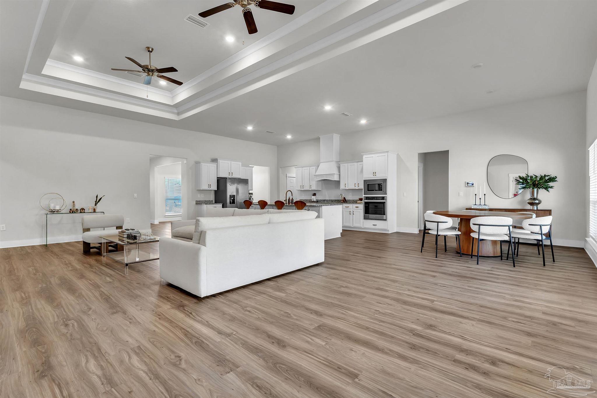 5531 Blake Lane Pace, FL 32571 - Photo 14 of 43 a living room with furniture and kitchen view