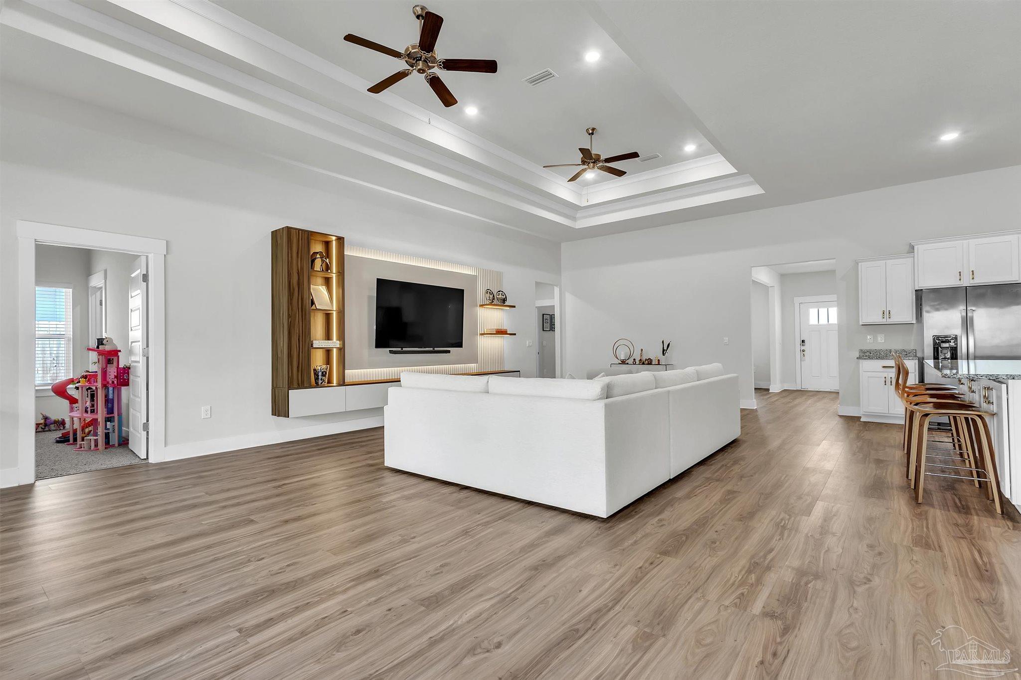 5531 Blake Lane Pace, FL 32571 - Photo 20 of 43 a living room with furniture and a flat screen tv