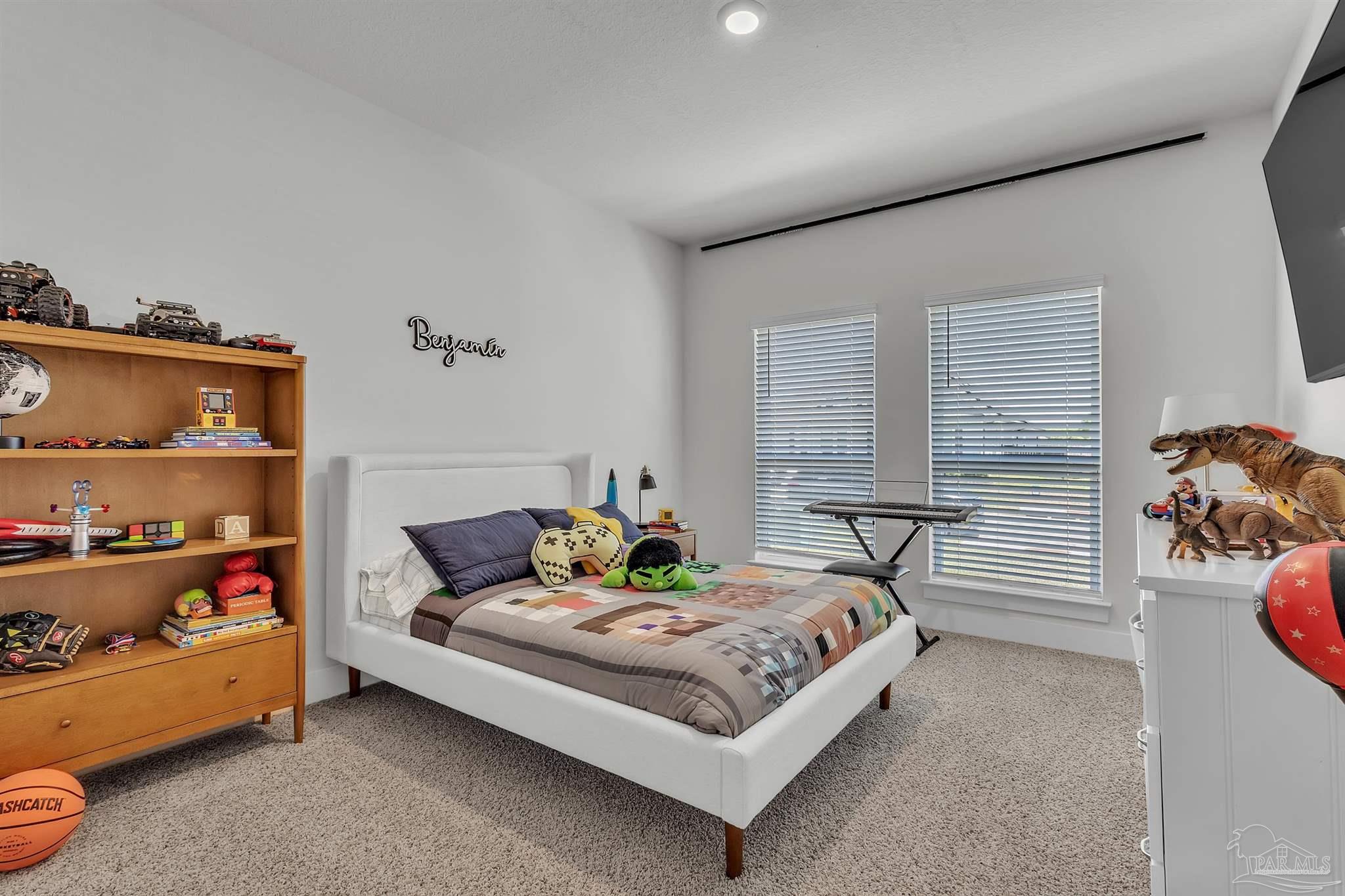 5531 Blake Lane Pace, FL 32571 - Photo 29 of 43 a bedroom with a bed and a window