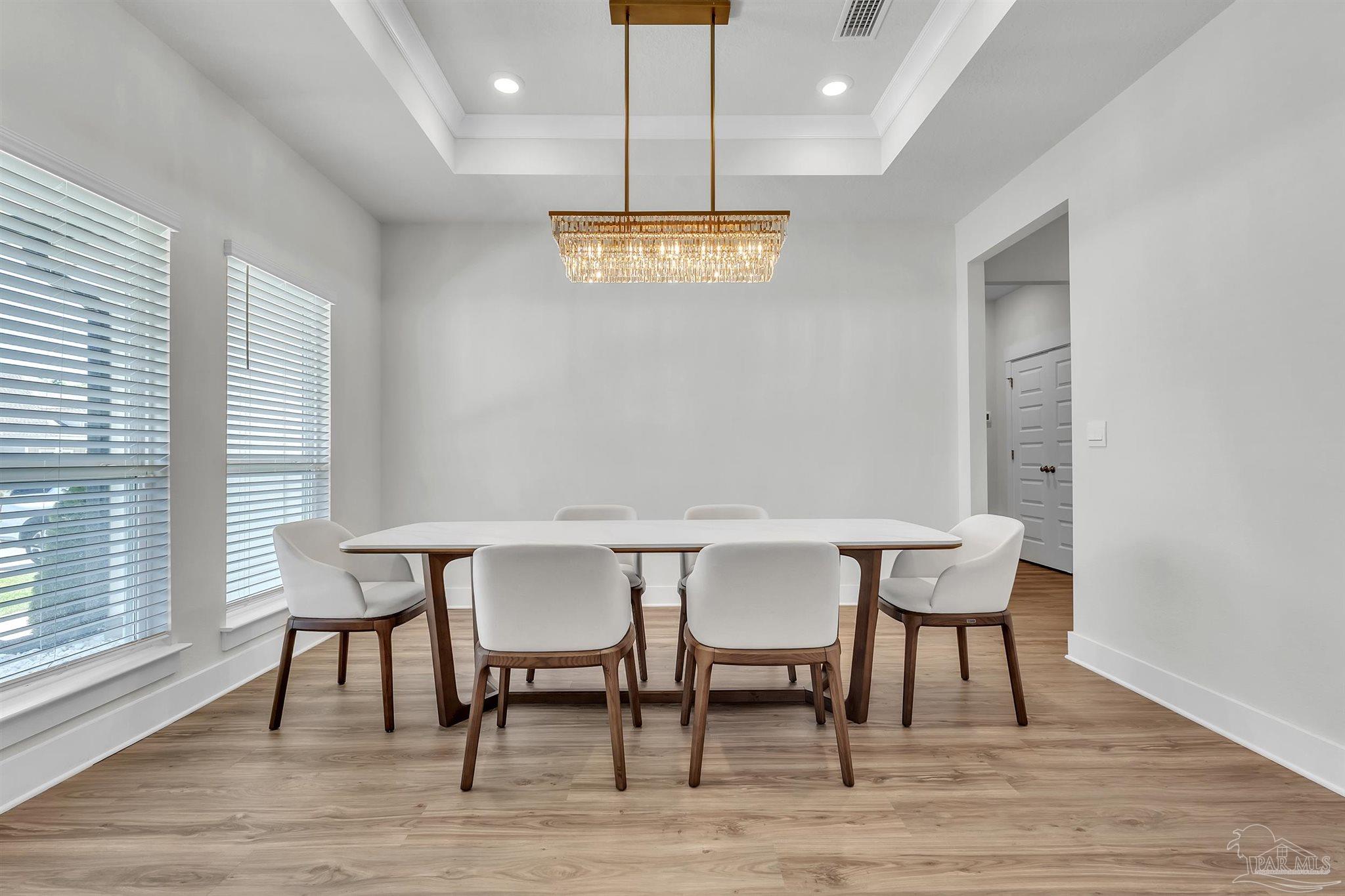 5531 Blake Lane Pace, FL 32571 - Photo 6 of 43 a view of a dining room with furniture window and wooden floor