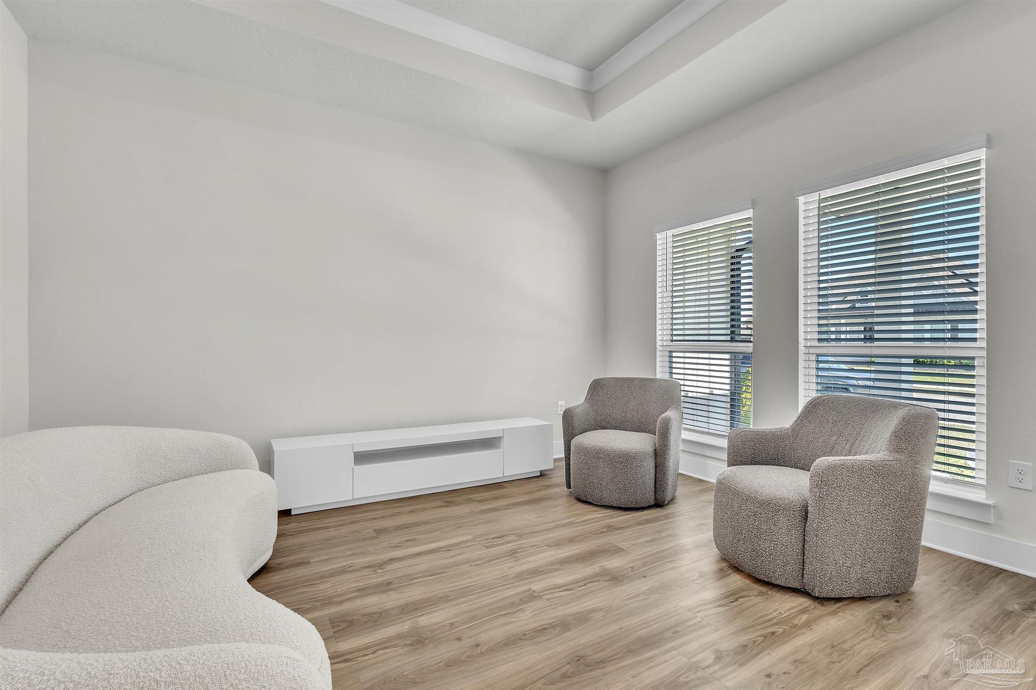 5531 Blake Lane Pace, FL 32571 - Photo 8 of 43 a living room with furniture and a window