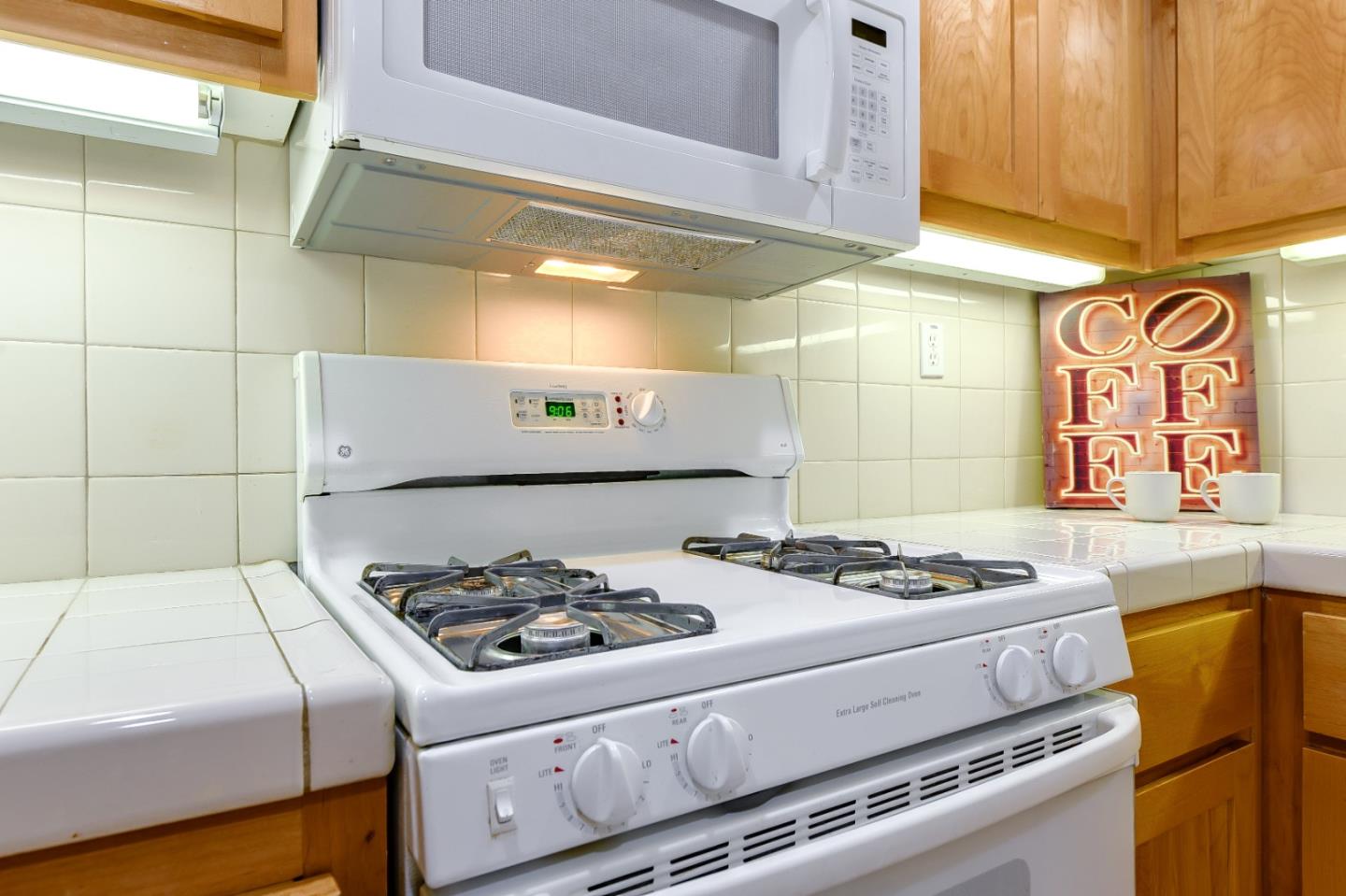 1476 Alegria Loop San Jose, CA 95128 - Photo 13 of 25 a kitchen with a stove and a sink