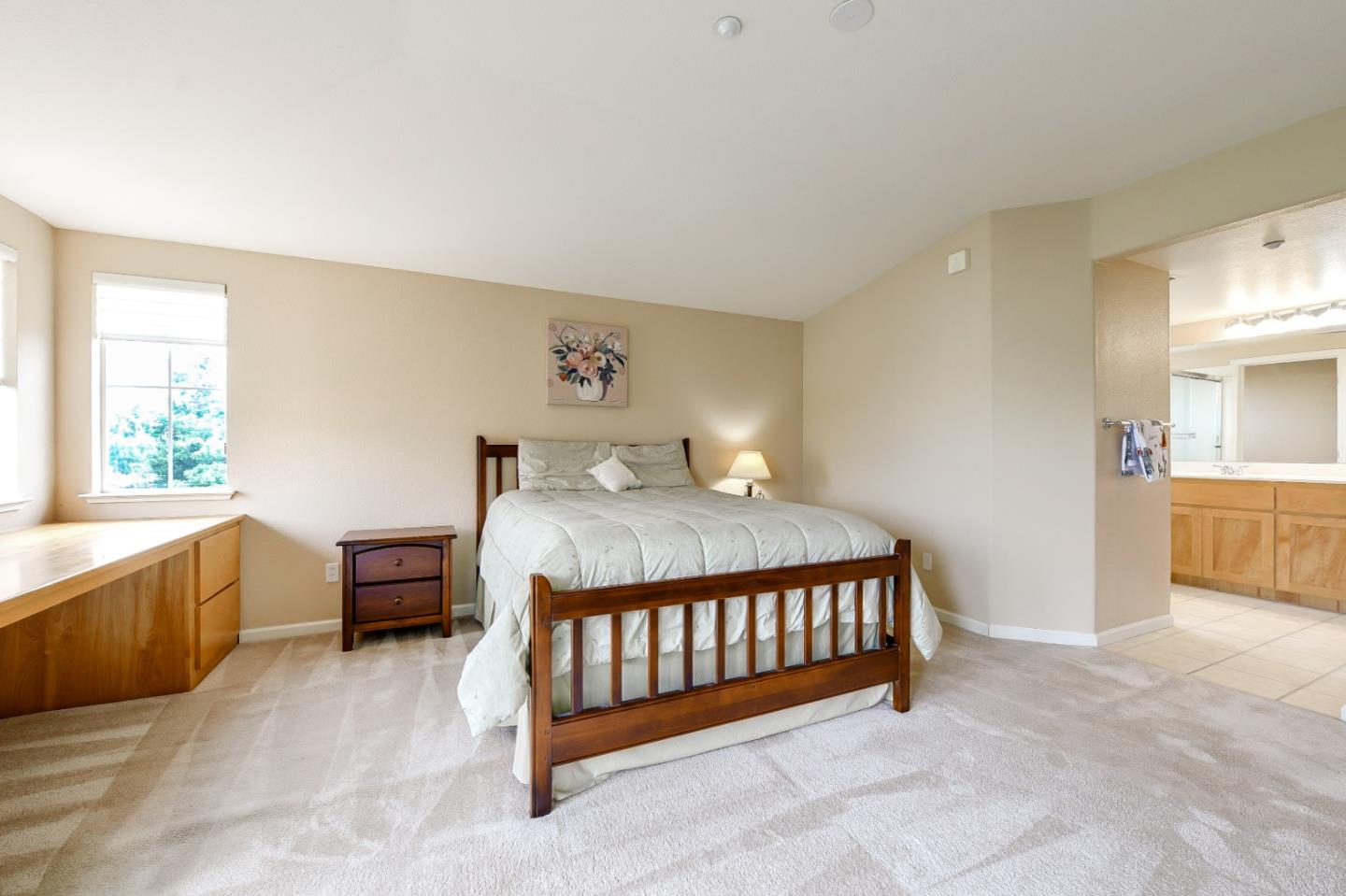1476 Alegria Loop San Jose, CA 95128 - Photo 16 of 25 a bedroom with a bed and a view of en suite bathroom