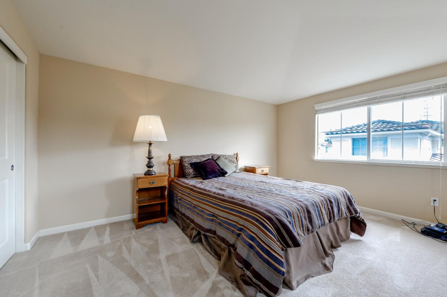 1476 Alegria Loop San Jose, CA 95128 - Photo 17 of 25 a bedroom with a bed and a window