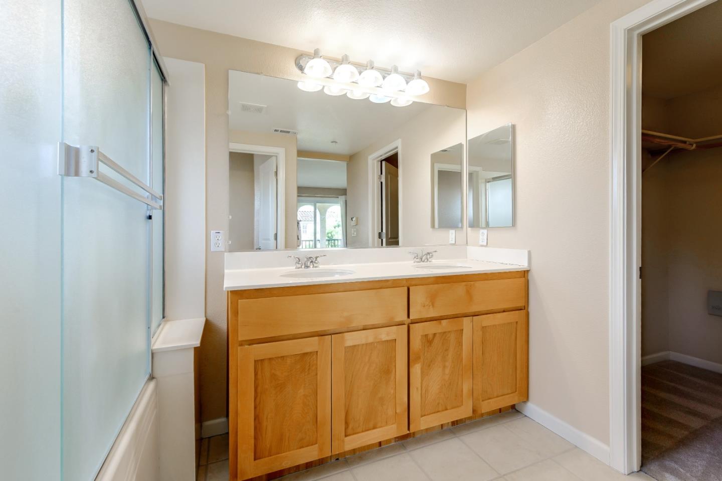 1476 Alegria Loop San Jose, CA 95128 - Photo 19 of 25 a bathroom with a sink vanity and mirror