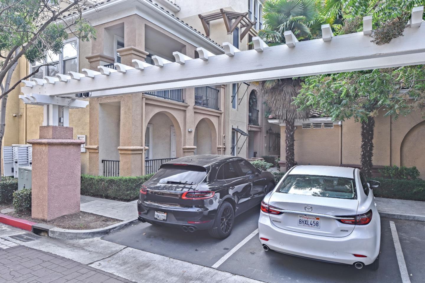 1476 Alegria Loop San Jose, CA 95128 - Photo 24 of 25 a car parked in front of white building