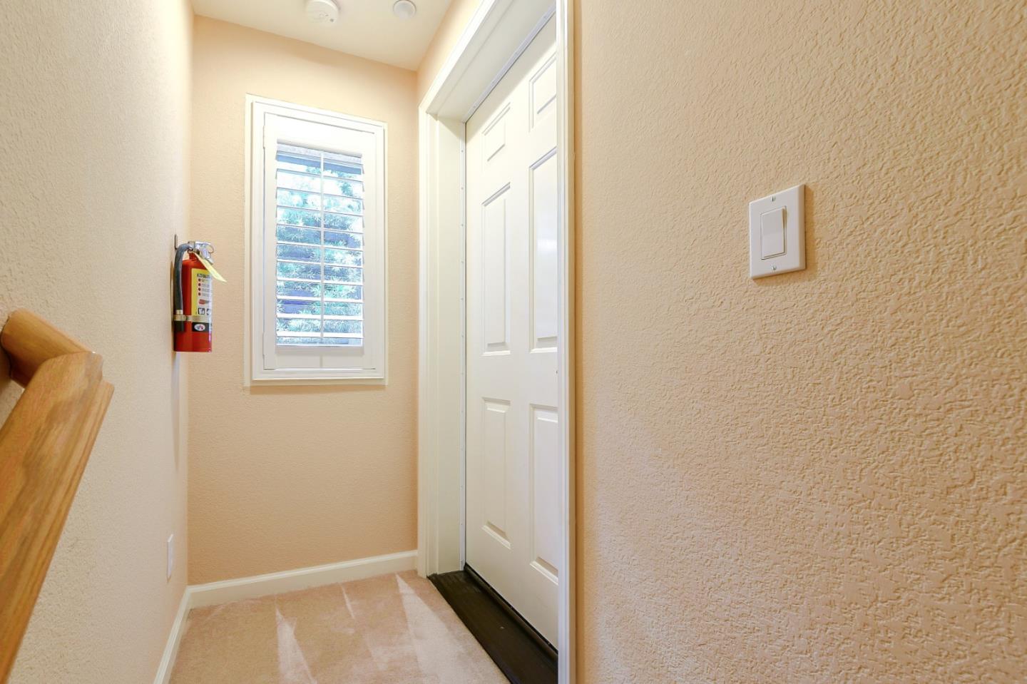 1476 Alegria Loop San Jose, CA 95128 - Photo 3 of 25 a view of hallway with a window and a bathroom