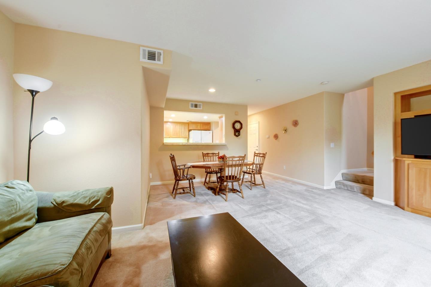1476 Alegria Loop San Jose, CA 95128 - Photo 4 of 25 a living room with furniture and a flat screen tv