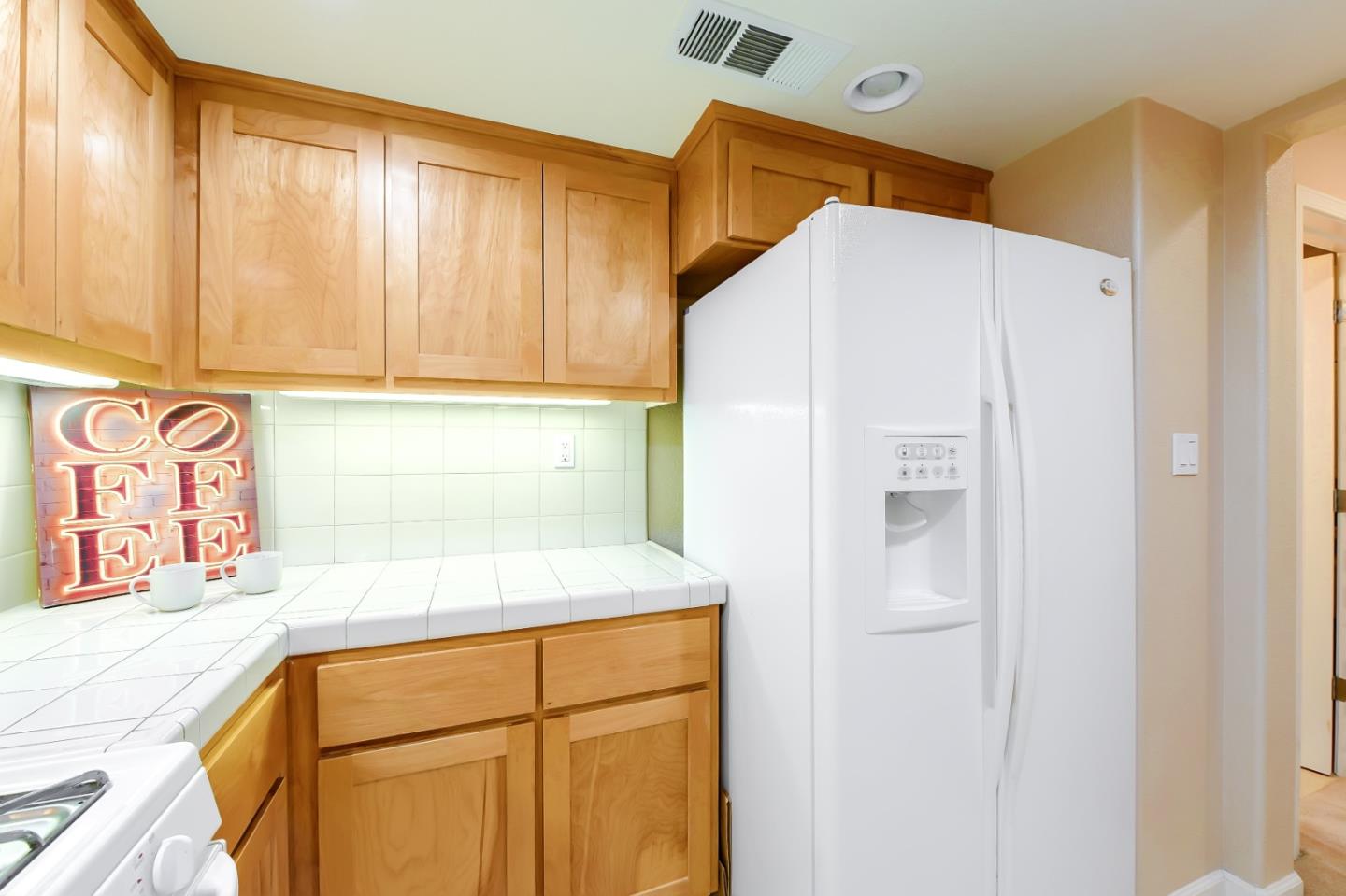 1476 Alegria Loop San Jose, CA 95128 - Photo 7 of 25 a white refrigerator freezer sitting in a kitchen