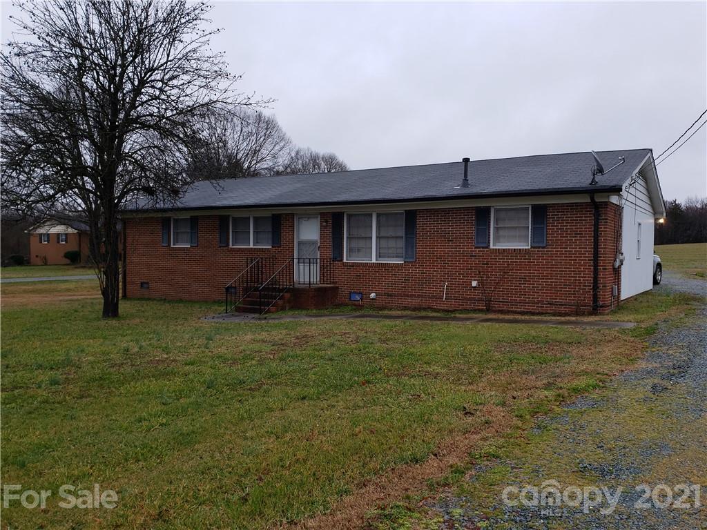 3718 Morgan Mill Road Monroe, NC 28110 - Photo 1 of 13 a backyard of a house with lots of green space