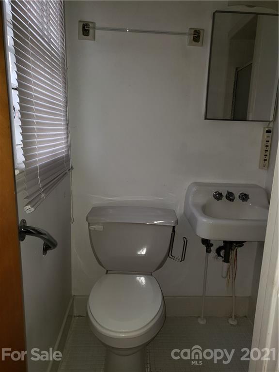 3718 Morgan Mill Road Monroe, NC 28110 - Photo 11 of 13 a bathroom with a toilet and a sink