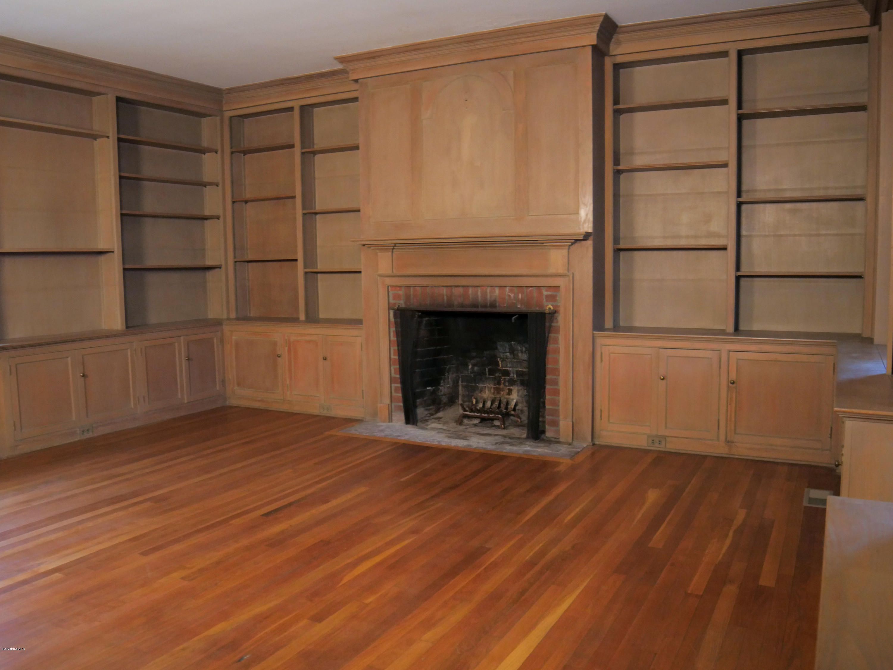 22 Prospect Hill Road Stockbridge, MA 01262 - Photo 37 of 78 a view of a room with wooden floor and a fireplace