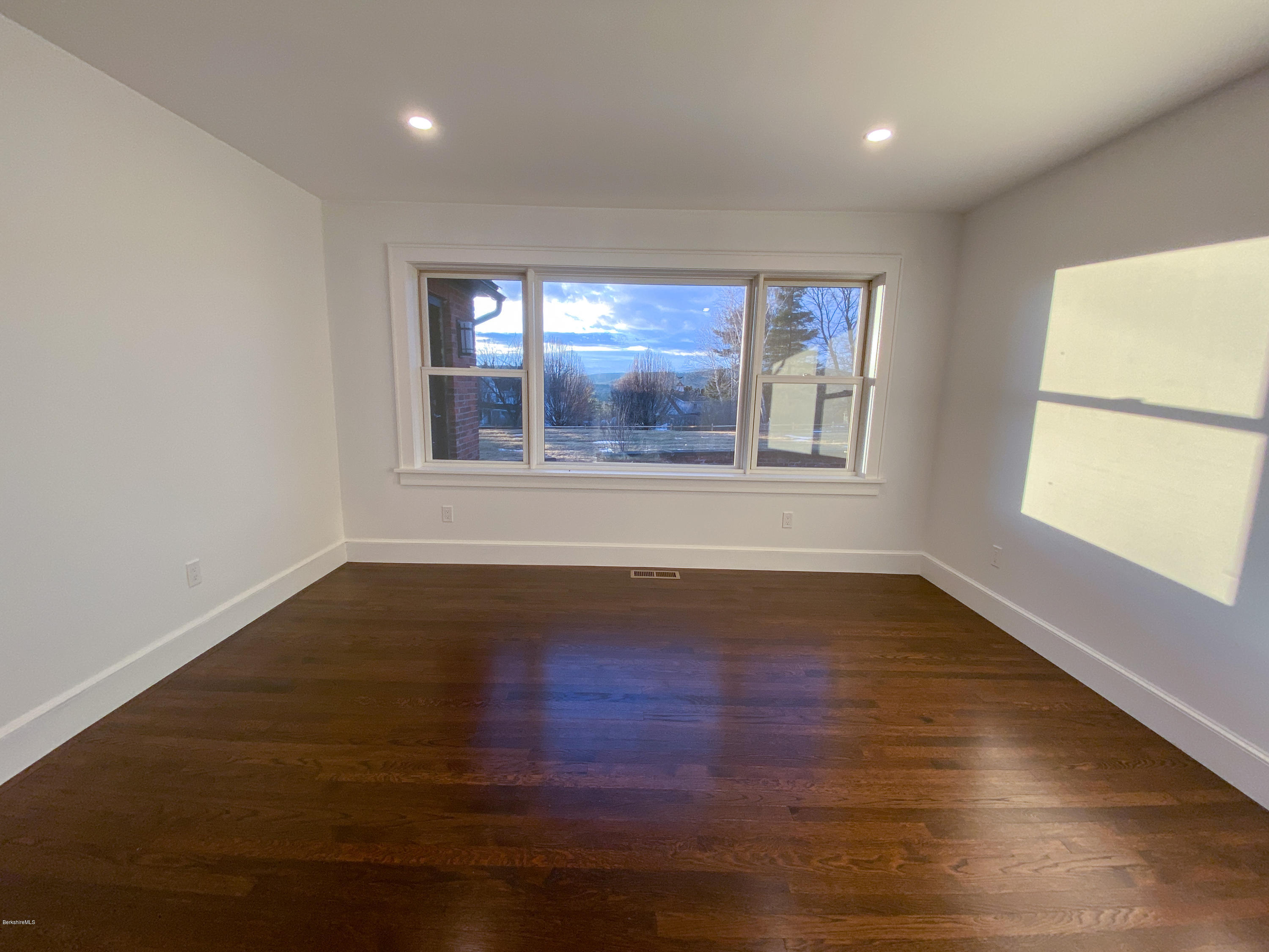 22 Prospect Hill Road Stockbridge, MA 01262 - Photo 47 of 78 an empty room with wooden floor and windows