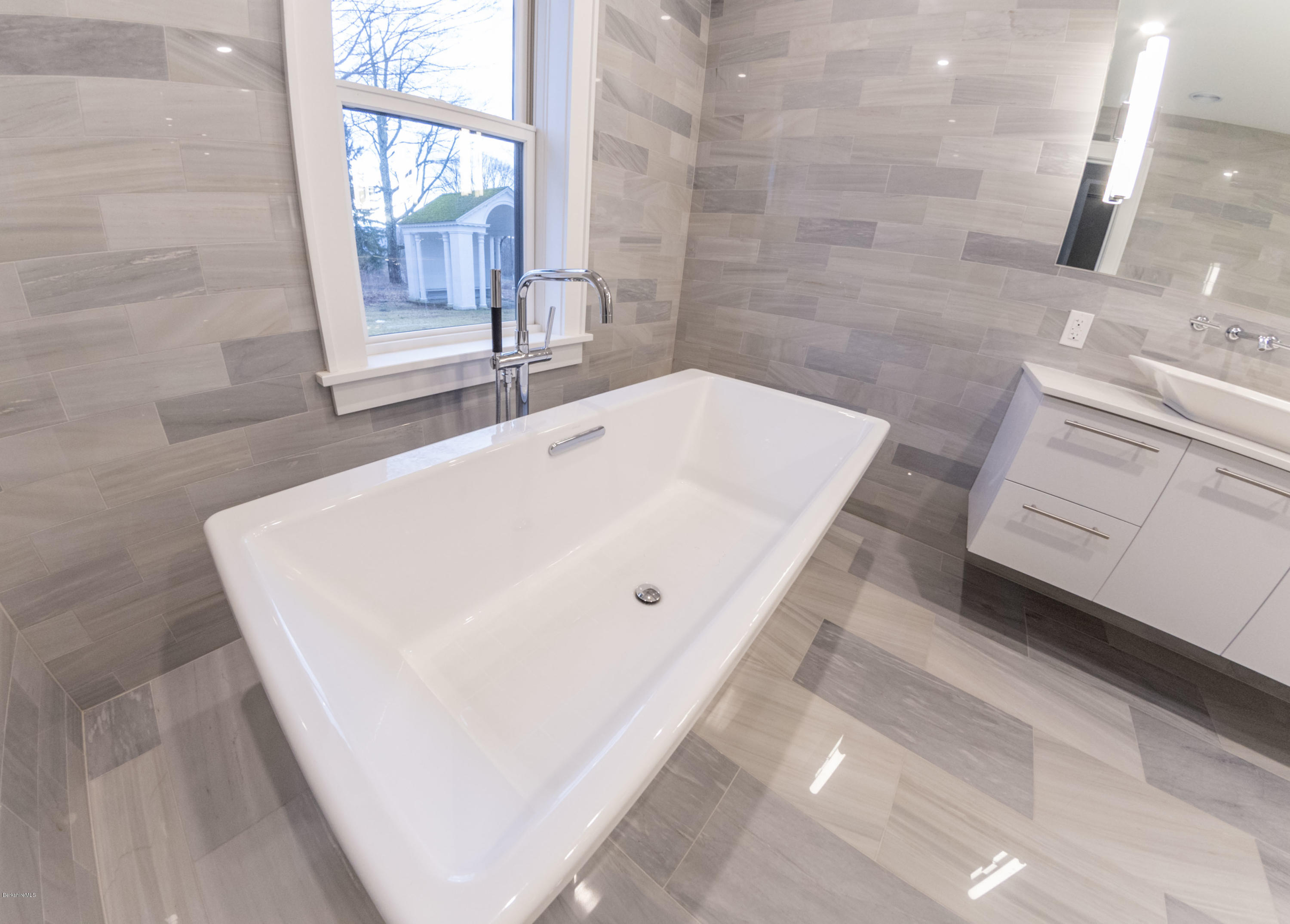 22 Prospect Hill Road Stockbridge, MA 01262 - Photo 50 of 78 a bath tub sitting in a bathroom next to a window