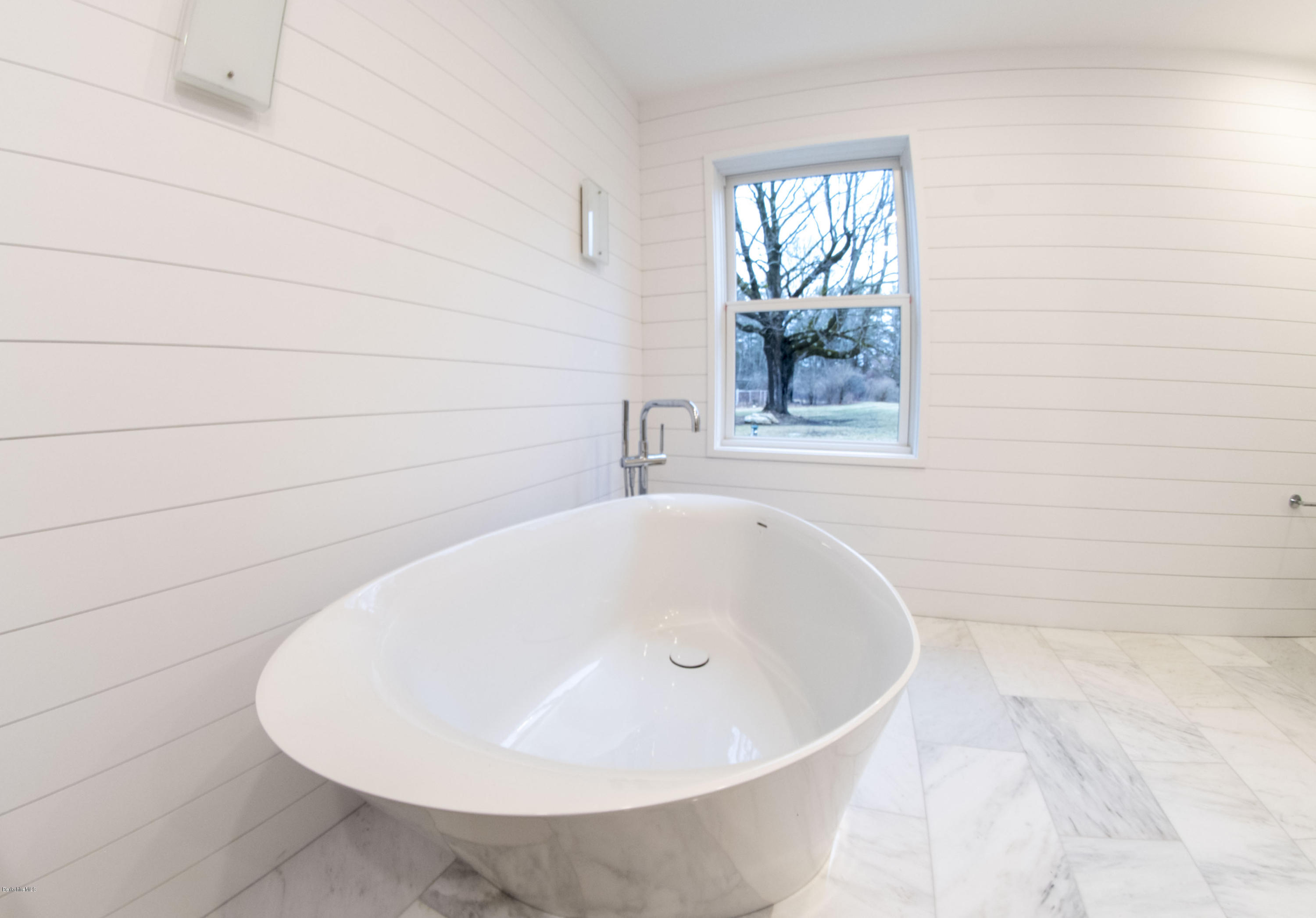 22 Prospect Hill Road Stockbridge, MA 01262 - Photo 74 of 78 a white bath tub sitting in a bathroom