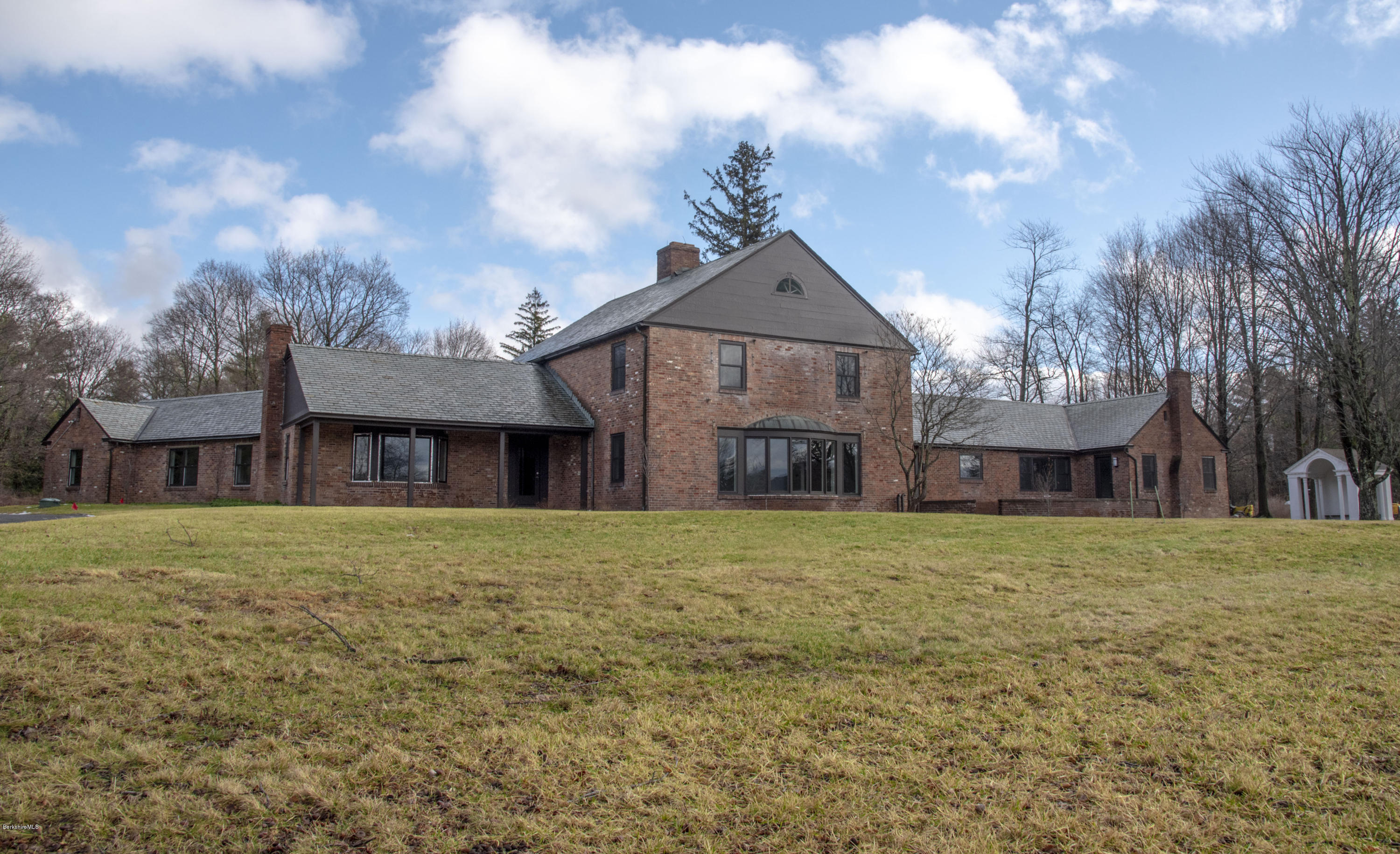 22 Prospect Hill Road Stockbridge, MA 01262 - Photo 9 of 78 a front view of a house with a garden