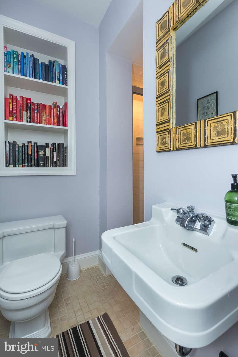 205 Longwood Road Baltimore, MD 21210 - Photo 12 of 30 a bathroom with a sink and a toilet