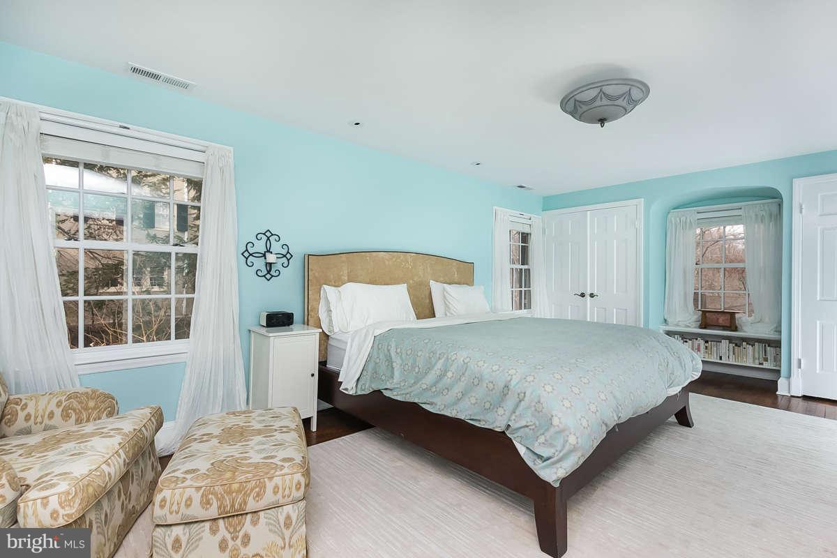 205 Longwood Road Baltimore, MD 21210 - Photo 17 of 30 a bedroom with a large bed and a window