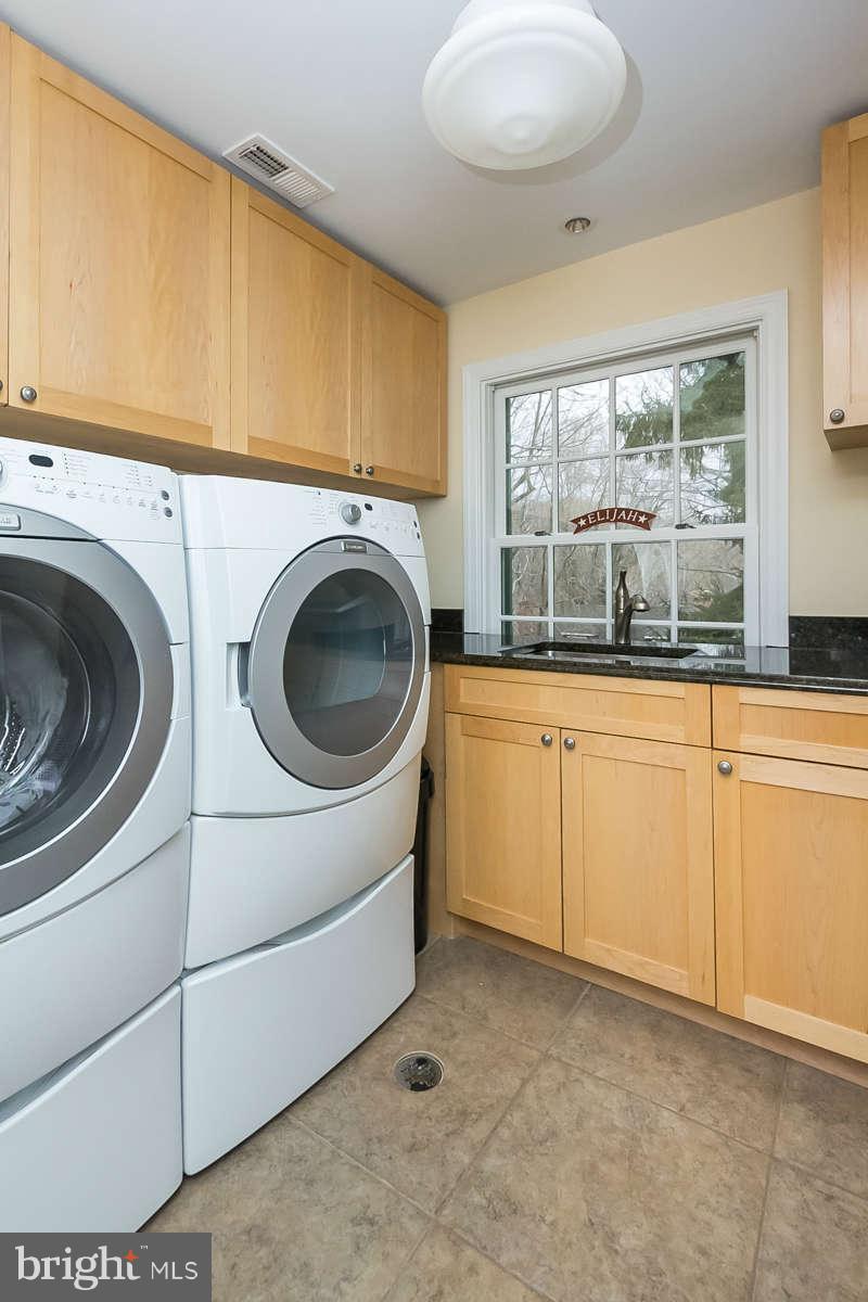 205 Longwood Road Baltimore, MD 21210 - Photo 23 of 30 a utility room with dryer and washer