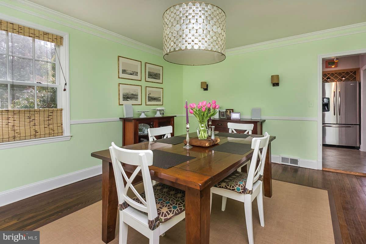205 Longwood Road Baltimore, MD 21210 - Photo 4 of 30 a view of a dining room with furniture window and wooden floor