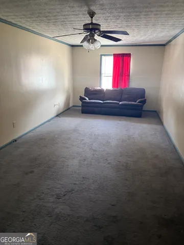 a living room with furniture and window
