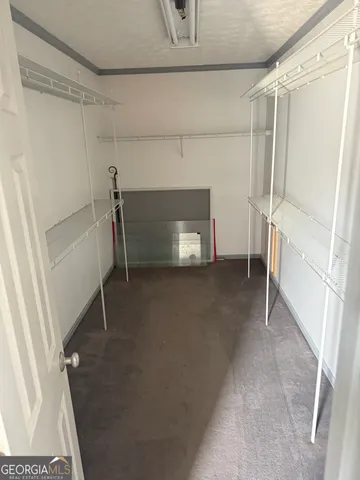 a view of an empty room with a fireplace