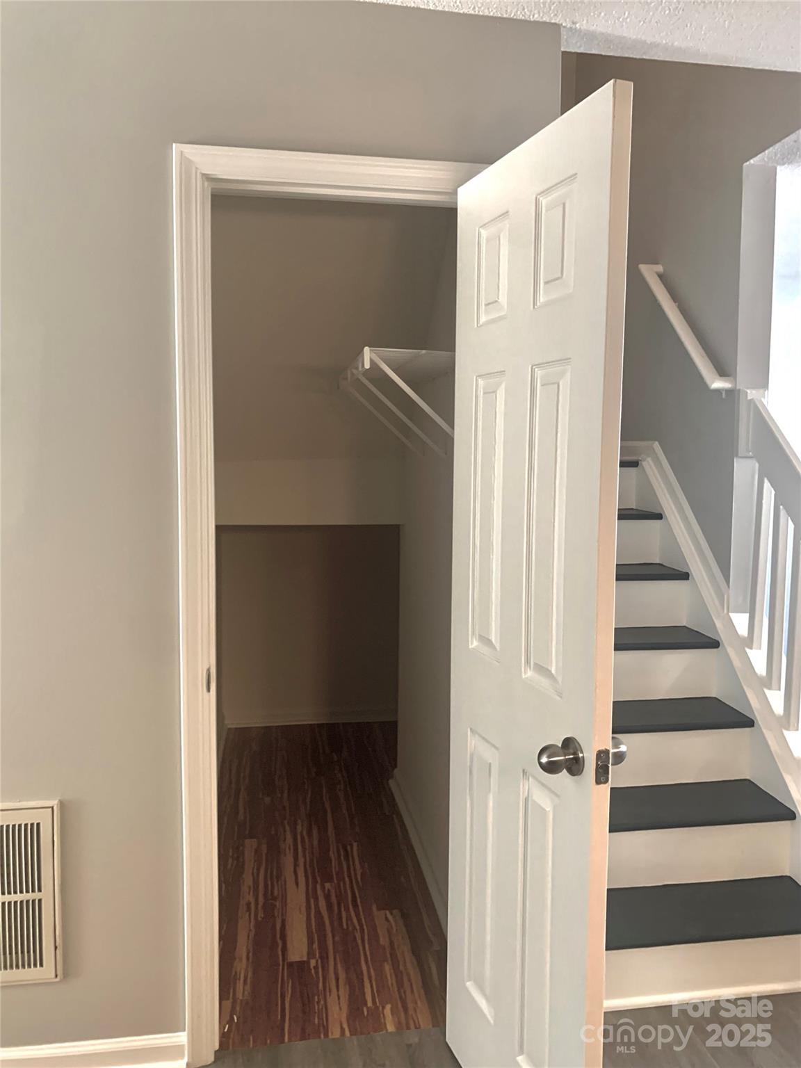 12640 Tucker Crossing Lane Charlotte, NC 28273 - Photo 12 of 36 a view of a hallway with wooden floor and staircase
