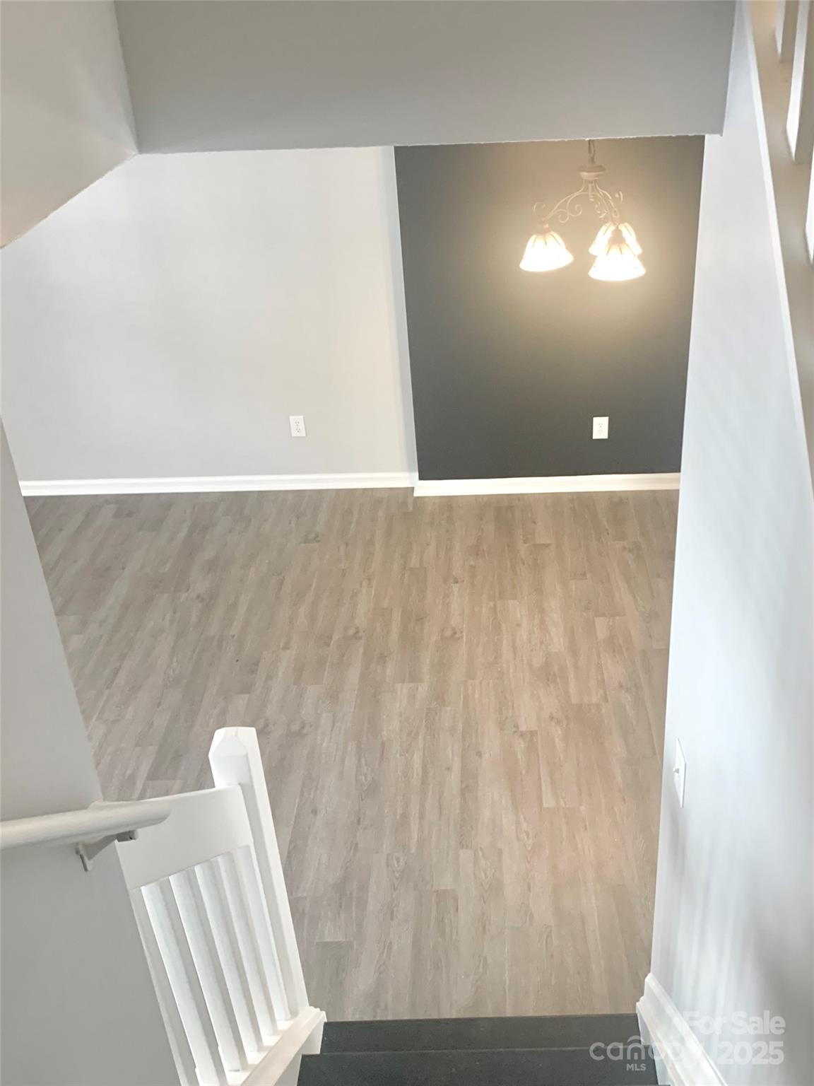 12640 Tucker Crossing Lane Charlotte, NC 28273 - Photo 13 of 36 a view of wooden floor and staircase
