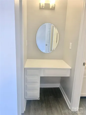 a room with a table and flowerpot