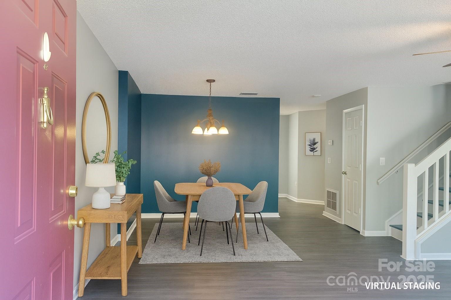 12640 Tucker Crossing Lane Charlotte, NC 28273 - Photo 4 of 36 a view of a dining room with furniture and wooden floor