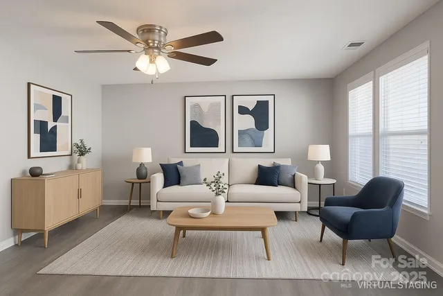 a living room with furniture and a large window
