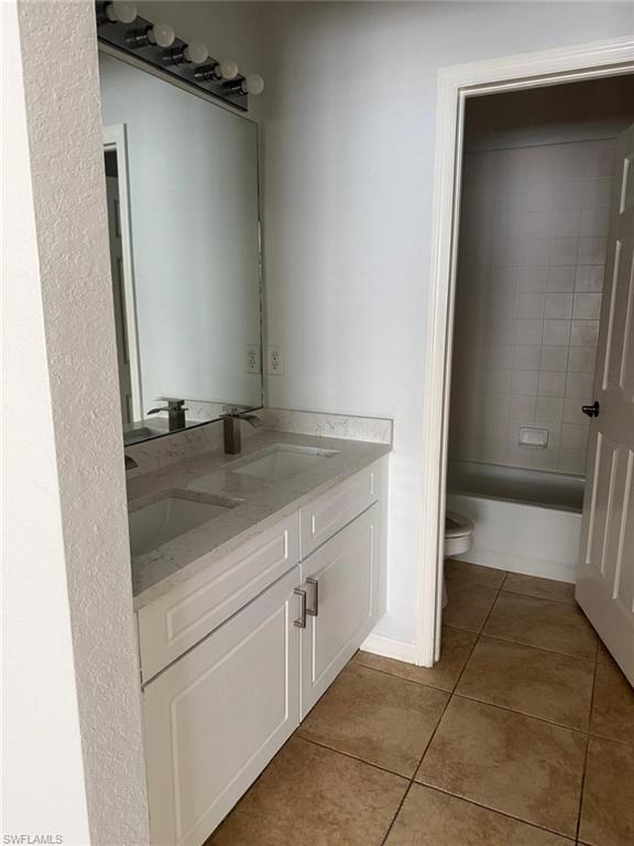 7350 Bristol Circle Naples, FL 34120 - Photo 6 of 8 a view of a storage and utility room with a sink