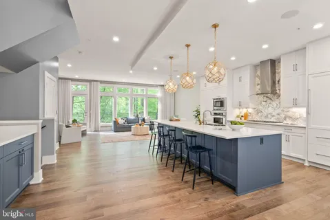a large kitchen with lots of counter space and a sink