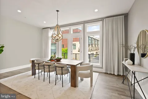 a dining room with furniture window wooden floor
