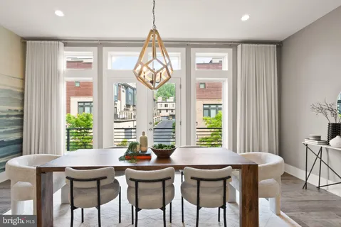 a kitchen with a table and chairs in it