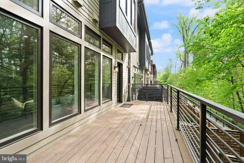 a bathroom with a toilet a sink and a window