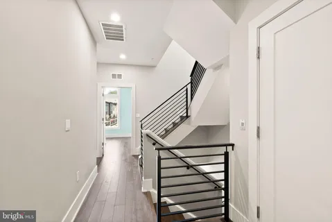 a bedroom with a large bed and a large window