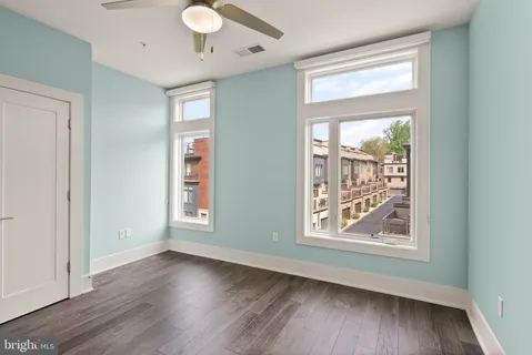 a bathroom with a granite countertop shower a sink and a mirror