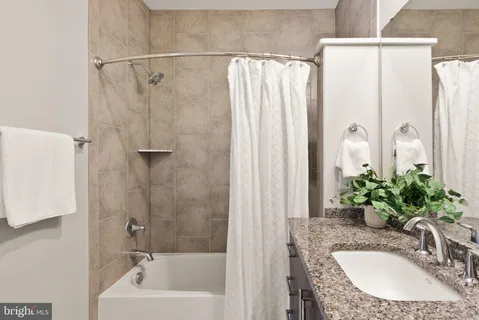 a view of room with window and wooden floor