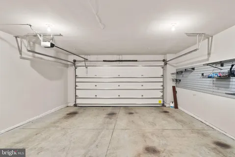 a view of a patio with table and chairs with wooden floor and fence