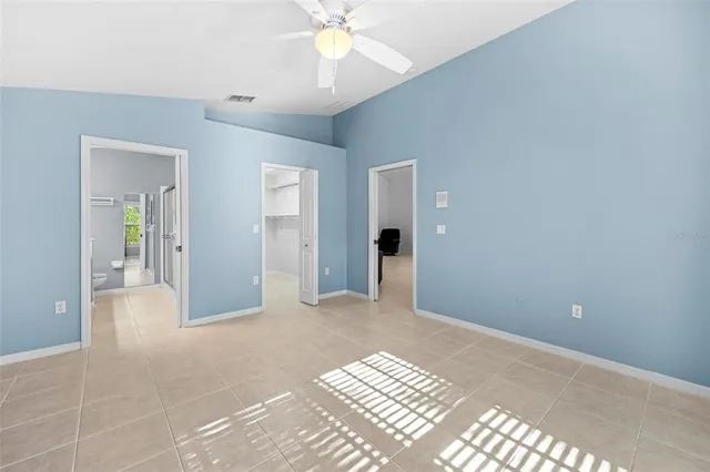 a spacious bathroom with a double vanity sink mirror and toilet