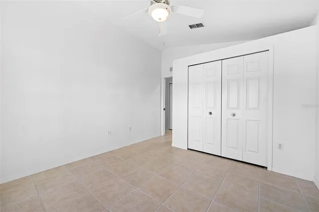 a view of a hallway with wooden cabinet and a living room