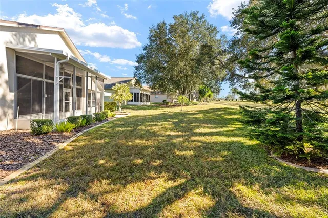 a view of a brick house with plants