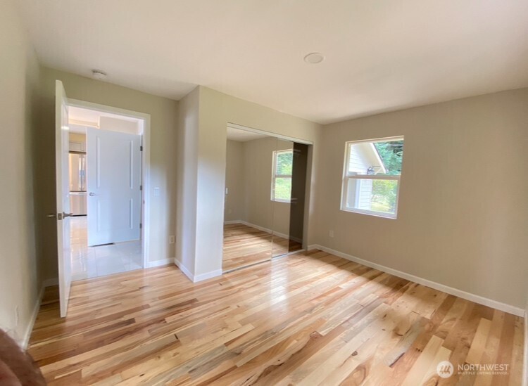 1304 Madrona Beach Road Northwest Olympia, WA 98502 - Photo 20 of 40 a view of livingroom with window and hardwood floor