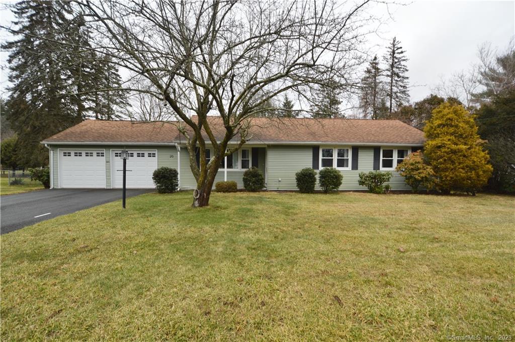20 Juniper Road Bristol, CT 06010 - Photo 1 of 1 a front view of a house with a yard