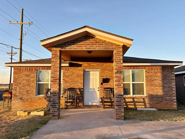 a front view of a house with patio